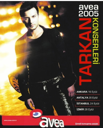 Tarkan in his silver jacket, captured in a moment of pure pop energy.